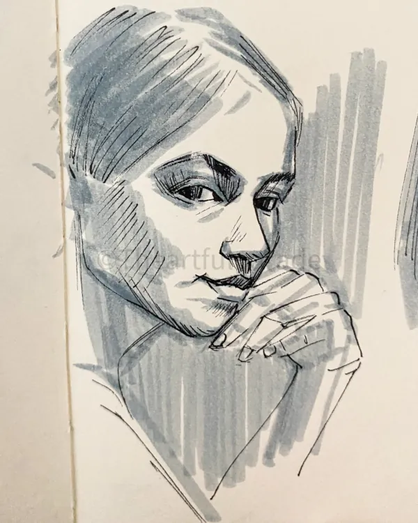 Portrait de femme dessiné aux feutres sur une page de carnet